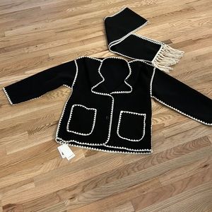 overcoat with off-white, detailed stitching, along with a matching scarf